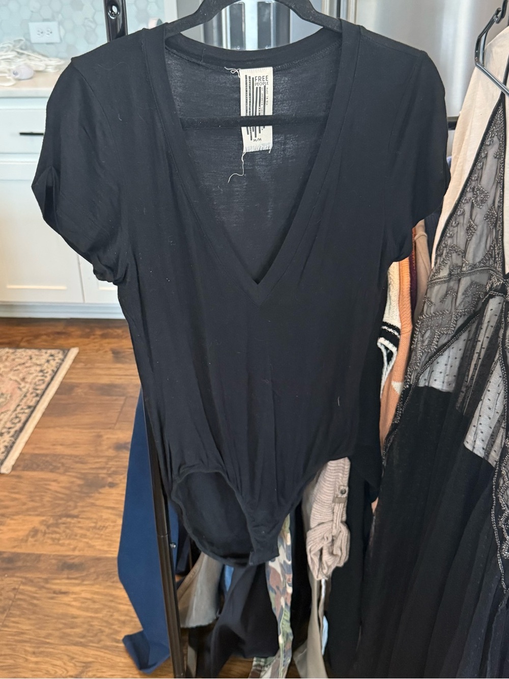Free people black short sleeve bodysuit